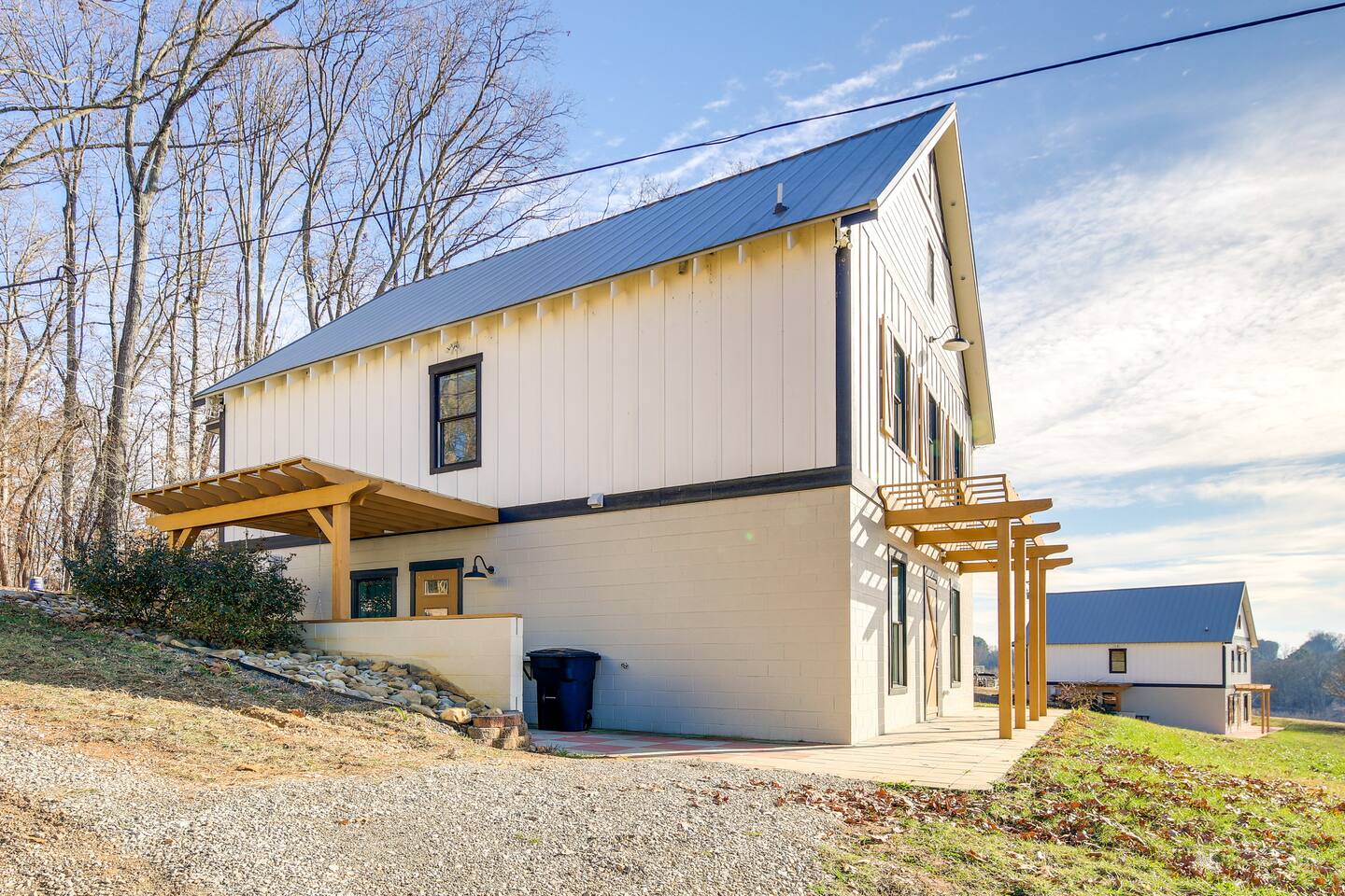 Here is a view of the side of the barndominium. with a patio for entertaining.